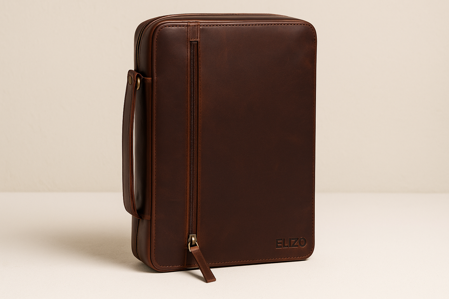 Closed premium brown leather Bible case with vertical zip pocket and subtle ELIZO branding, photographed in high resolution to highlight craftsmanship and protective design for sacred texts.
